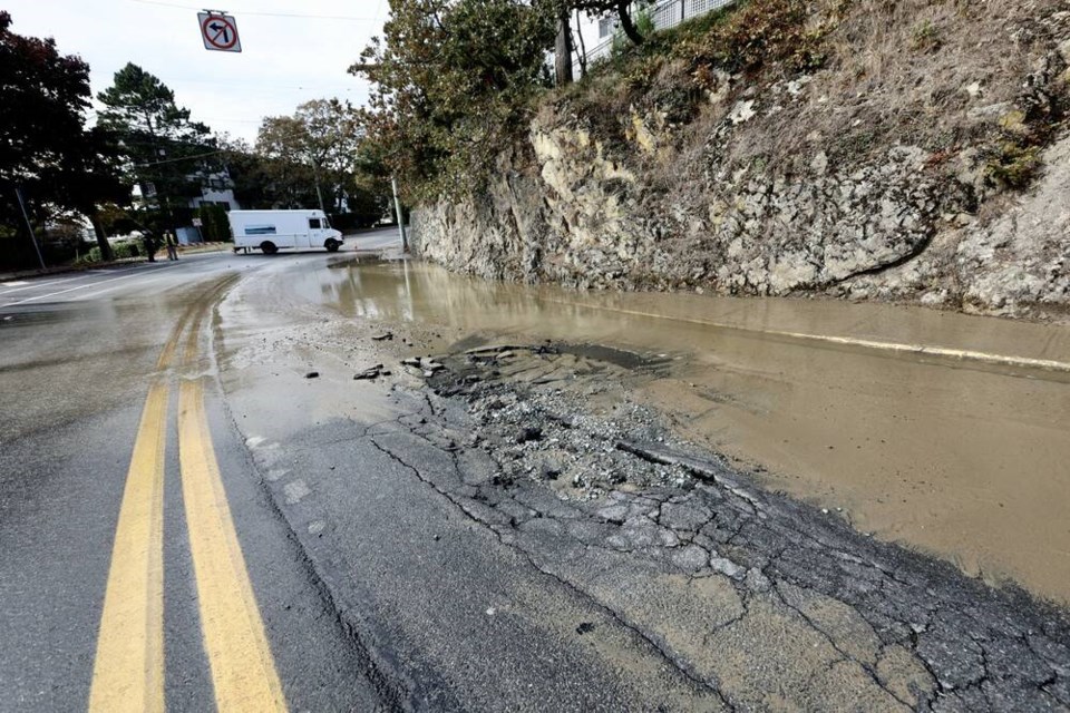 Esquimalt Road between Lampson and Head streets was closed Friday afternoon due to a water-main failure. DARREN STONE, TIMES COLONIST 