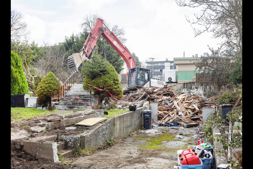 The house at 833 Old Esquimalt Rd., behind the old bingo hall, was knocked down on Wednesday. DARREN STONE, TIMES COLONIST 