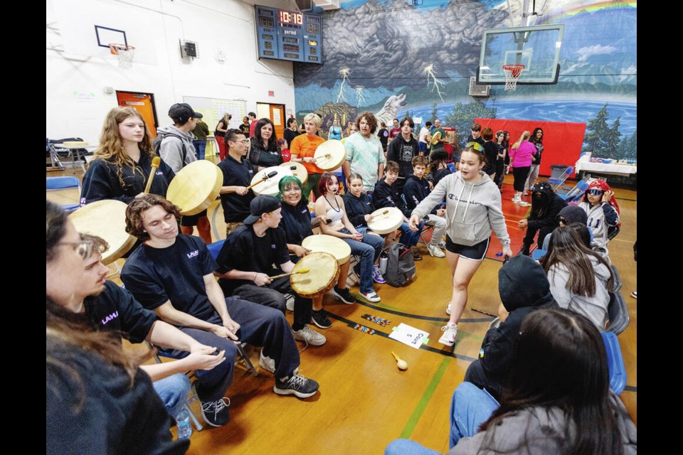Students at a multi-school tournament at Spectrum Community School play an Indigenous game called Lahal that uses special sticks, accompaned by drummers and singers. DARREN STONE, TIMES COLONIST 