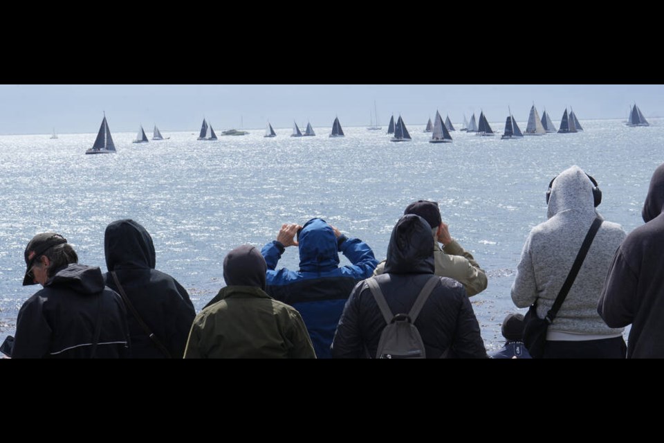 People watch from Clover Point at the start of the Swiftsure International Yacht Race on Saturday. ADRIAN LAM, TIMES COLONIST 