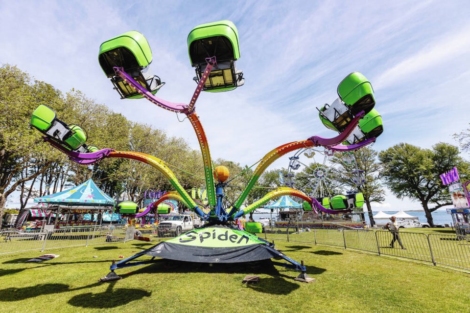 An updated version of the Spider was among the rides being set up in Willows Park on Thursday for the Oak Bay Tea Party, which begins today. DARREN STONE, TIMES COLONIST 