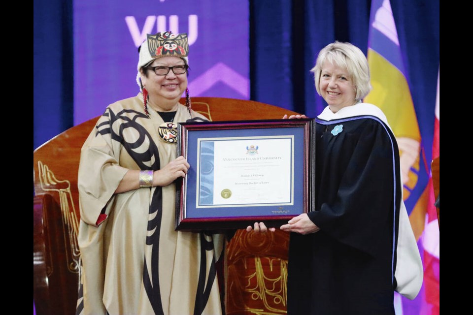 Dr. Bonnie Henry, СƵ’s provincial health officer, receives an honorary degree from Vancouver Island ­University chancellor Judith Sayers on Wednesday. Story, A4 VANCOUVER ISLAND UNIVERSITY 