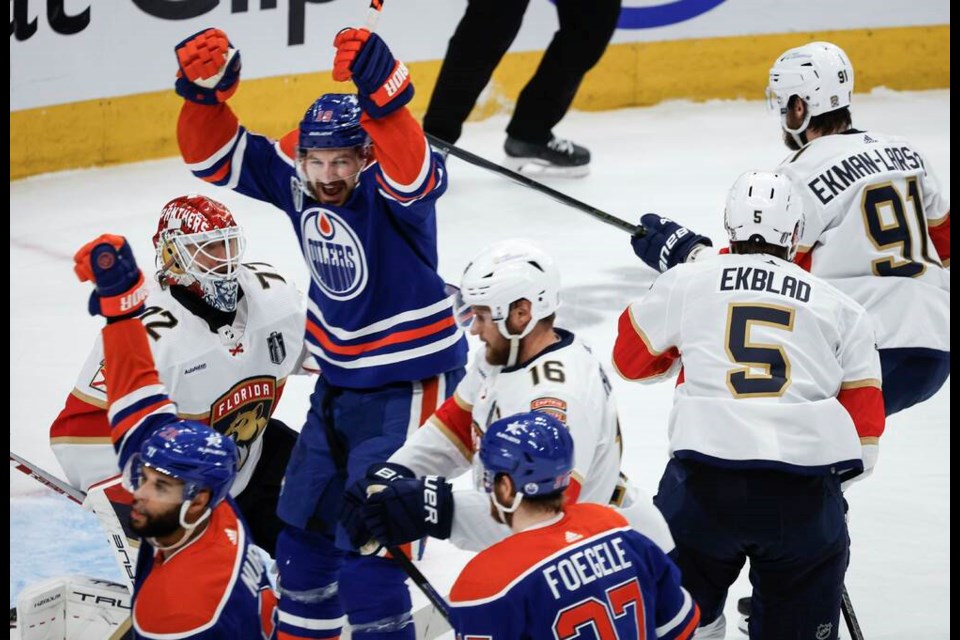 Florida Panthers goalie Sergei Bobrovsky (72) looks on as Edmonton Oilers' Zach Hyman (18) celebrates a goal during the second period of Game 4 of the NHL hockey Stanley Cup final in Edmonton, Saturday, June 15, 2024. THE CANADIAN PRESS/Jeff McIntosh