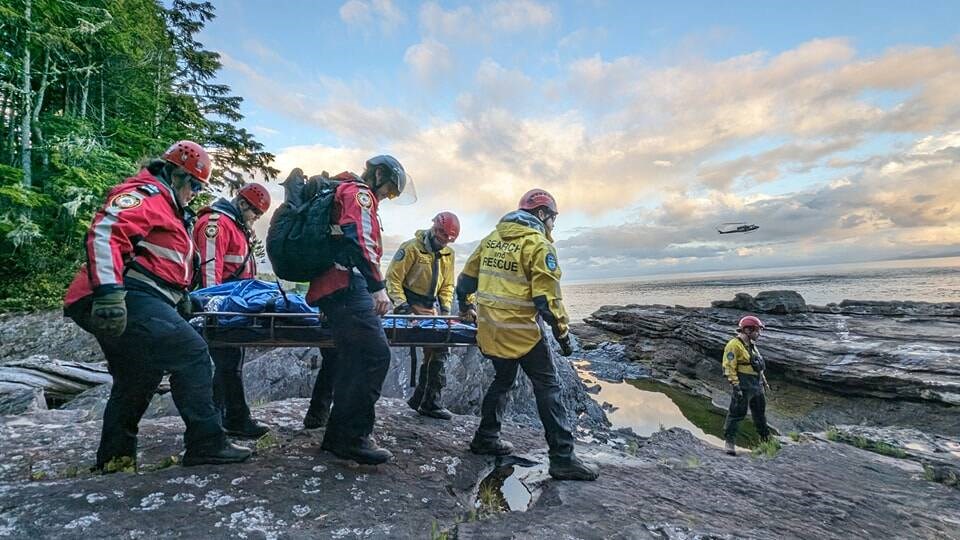 Search-and-rescue crews prepare a hiker to be transported by helicopter from the Juan de Fuca Trail on June 15, 2024. VIA JUAN DE FUCA SEARCH AND RESCUE 