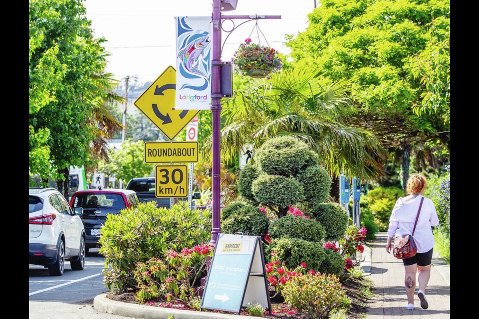 New street banners hanging along Langford’s Goldstream Avenue celebrate both Indigenous history and Pride month with a colourful image of a “rainbow” trout. DARREN STONE, TIMES COLONIST 