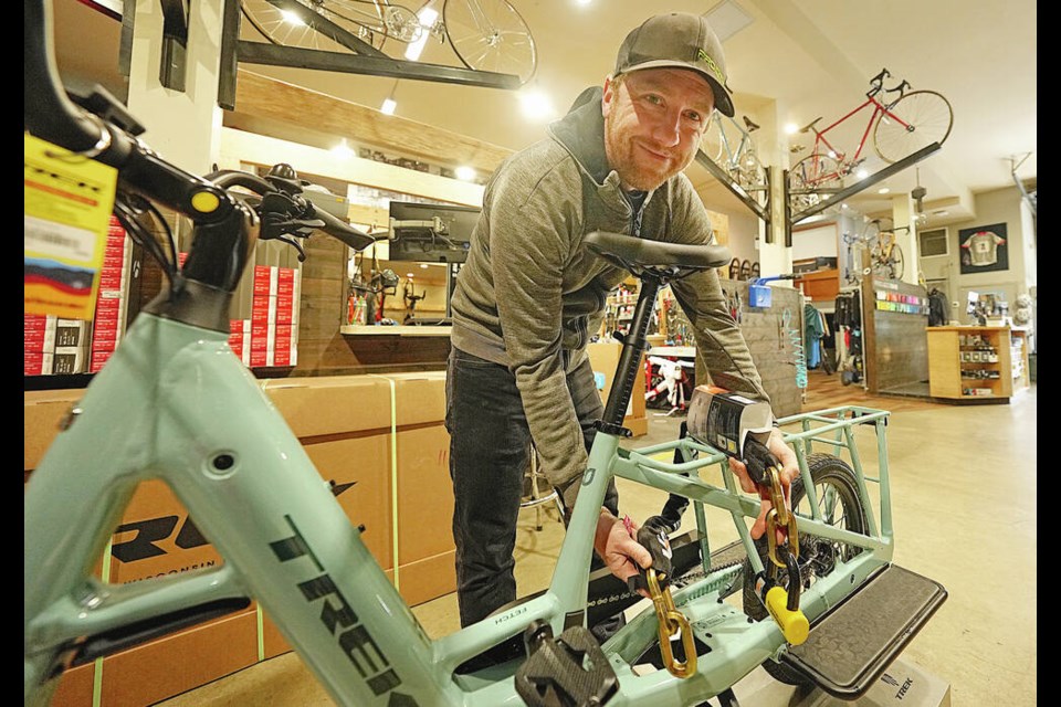 Alan Walker from Trek Bicycle Store shows off a selection of locks that help deter bike thefts. ADRIAN LAM, TIMES COLONIST 