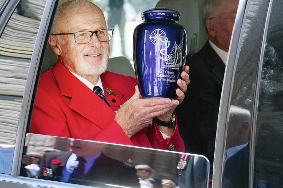 Simon Chance holds the urn after a memorial service for his father, retired commander Peter Godwin Chance, at Christ Church Cathedral on Wednesday. ADRIAN LAM, TIMES COLONIST 