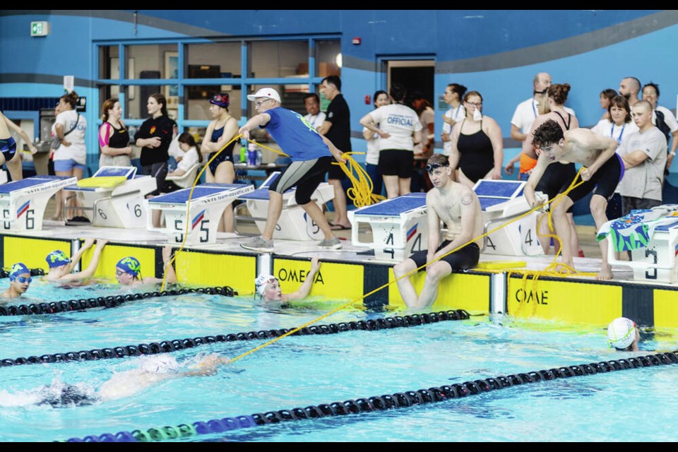 Competitors practise rope toss during the Canadian Pool Lifesaving Championships at Saanich Commonwealth Place on Saturday. DARREN STONE, TIMES COLONIST  