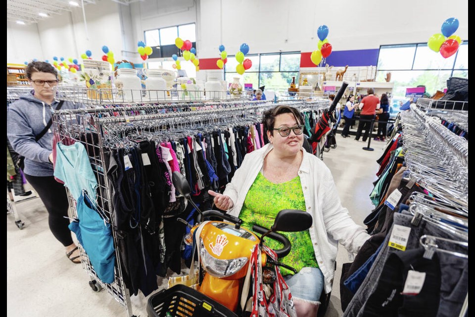 Audra Gummerson was the first customer at the grand opening of a new Salvation Army thrift store in Langford on Thursday. DARREN STONE, TIMES COLONIST 