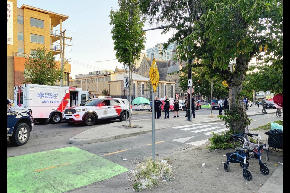 On Thursday night, Pandora Avenue was closed off by police vehicles. After a paramedic was attacked, at least a dozen emergency vehicles and about 20 officers were on the scene, ­including the Greater Victoria Emergency Response Team. TIMES COLONIST 