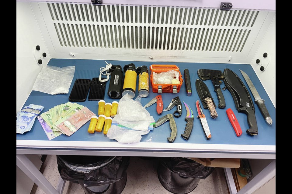 Officers confiscated a number of weapons inside a tent, including eight knives, two machetes, three cans of bear spray, a hatchet and a baton following the arrest of a woman on Pandora Avenue on July 15, 2024. VIA VICTORIA POLICE 