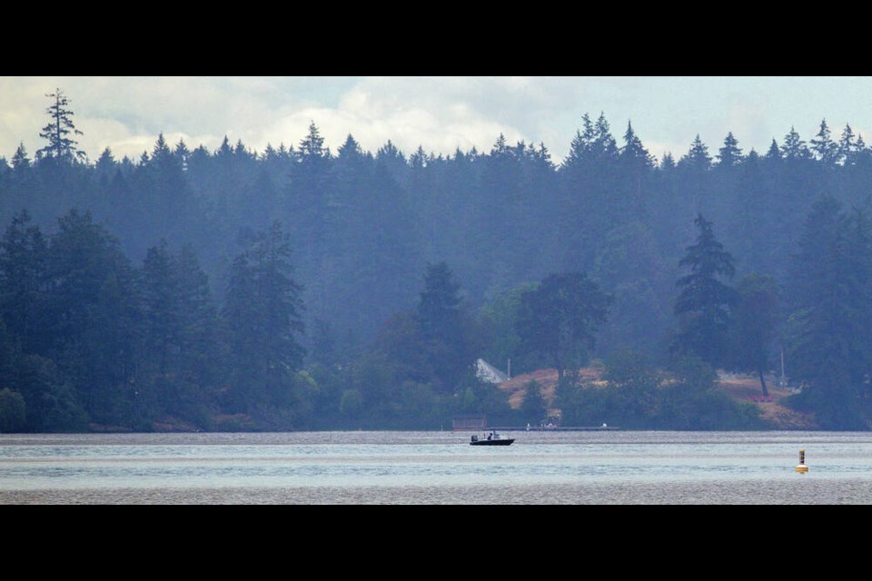 Smoke from the Old Man Lake wildfire east of Sooke settles over Prospect Lake on Wednesday. DARREN STONE, TIMES COLONIST 