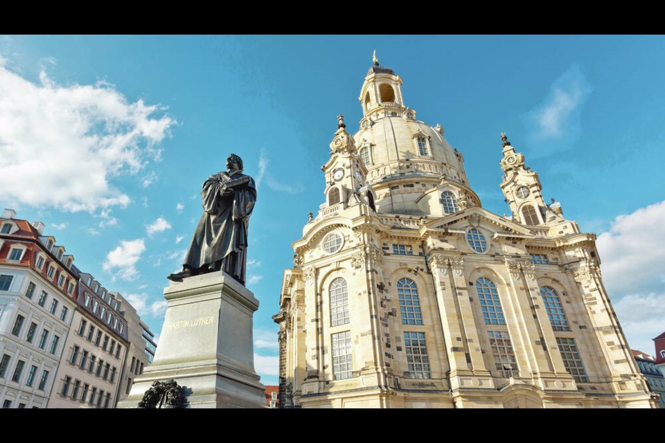 Martin Luther looms large outside the lovingly rebuilt Frauenkirche, which had lain in ruins for nearly six decades.  DOMINIC ARIZON BONUCCELLI 