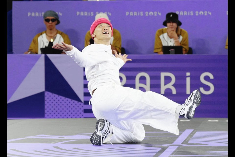 Philip (Phil Wizard) Kim of Vancouver performs in the breaking event during the Summer ­Olympics in Paris on Saturday. Kim took gold in the first Olympic men’s breaking tournament. CHRISTINNE MUSCHI, CP 