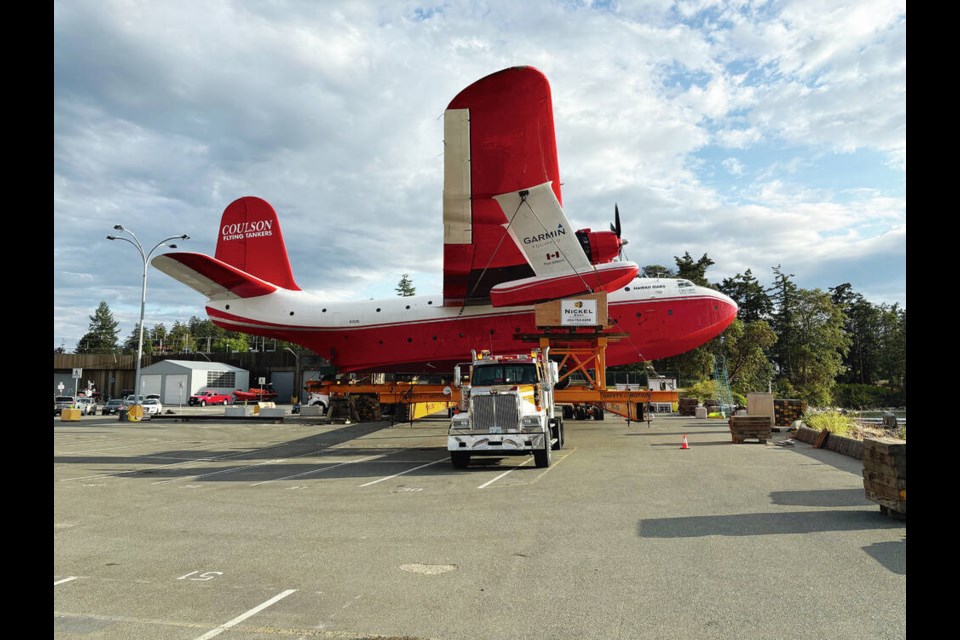 Hawaii Martin Mars slowly moves on a trailer at the coast guard facility at Patricia Bay on Wednesday, beginning its slow land journey to the saʴý Aviation Museum in North Saanich. STEVE NICHOL, saʴý AVIATION MUSEUM 