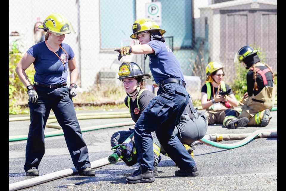 ​​​​​​​​​Fire-hose training at Fire Hall #3 in Victoria during a summer firefighting camp for girls in Grade 11 and 12. The teens  who hailed from all across 91ԭ Island and the Gulf Islands  were hosted at University of Victoria dormitories and spent a July weekend at various fire and urban search-and-rescue sites in the capital region learning firefighting skills. DARREN STONE, TIMES COLONIST 