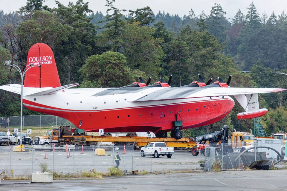 The 120-foot-long Hawaii Martin Mars is prepared for the next step in its journey to the B.C. Aviation Museum in North Saanich. DARREN STONE, TIMES COLONIST 