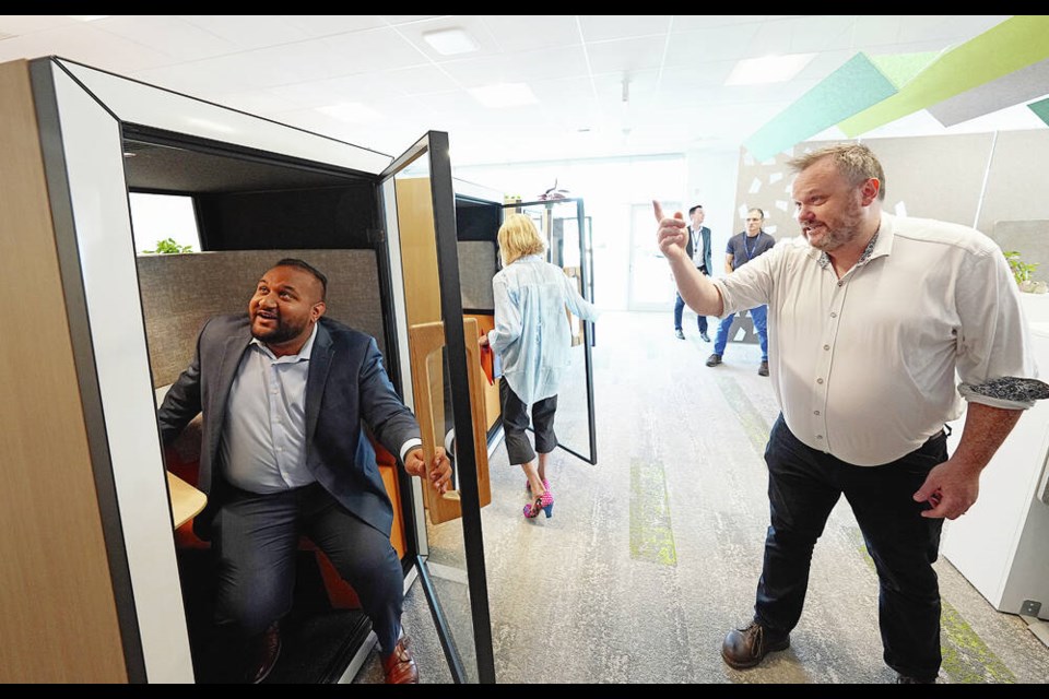 Clinical co-ordinator Jeremiah Bach shows Ravi Parmar, MLA for Langford-Juan de Fuca, one of the phone booths in the staff hive area, during a tour of the newly completed Westshore Mental Health and Substance Use Hub at 681 Allandale Rd. in Colwood. ADRIAN LAM, TIMES COLONIST 