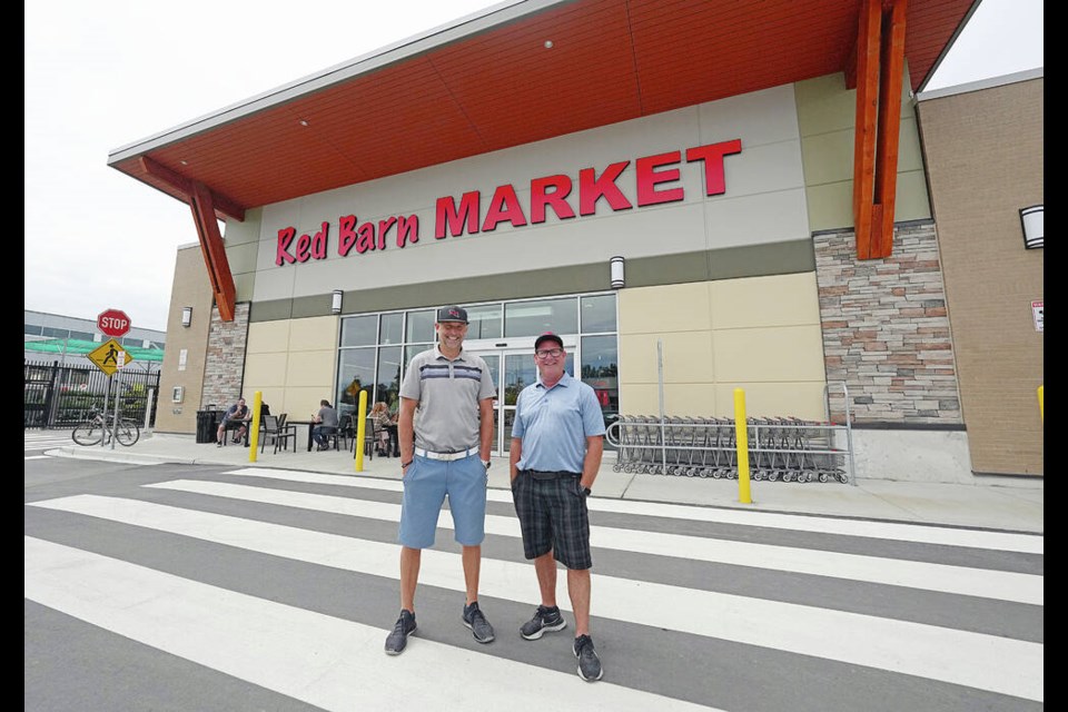 Red Barn Market owners Russ Benwell, left, and Ashley Bourque in front of the new 10,000-square-foot store at Sandown Park Shopping Centre on McDonald Park Road in North Saanich. ADRIAN LAM, TIMES COLONIST 