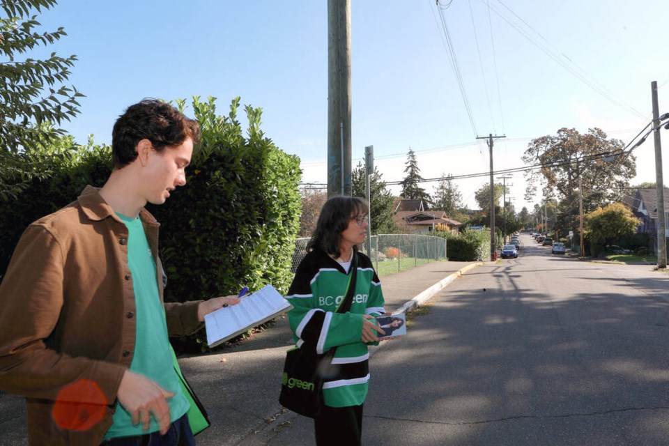 B.C. Green Party Leader Sonia Furstenau officially launches her campaign for Victoria-Beacon Hill with her son Peter Salmon as they door knock in the Fernwood area in Victoria, Saturday, Sept. 21, 2024. THE CANADIAN PRESS/Chad Hipolito 