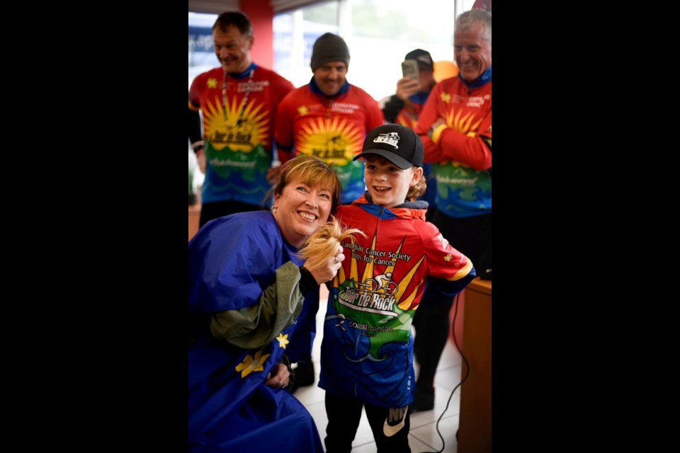 Port Hardy Coun. Janet Dorward shaved her head  with a little help from Weston Ireton  to raise money for Cops for Cancer Tour de Rock on Sunday, Sept. 22, 2024. Weston, 8, was diagnosed with leukemia at two years old and is now two years out of treatment. TOUR DE ROCK 