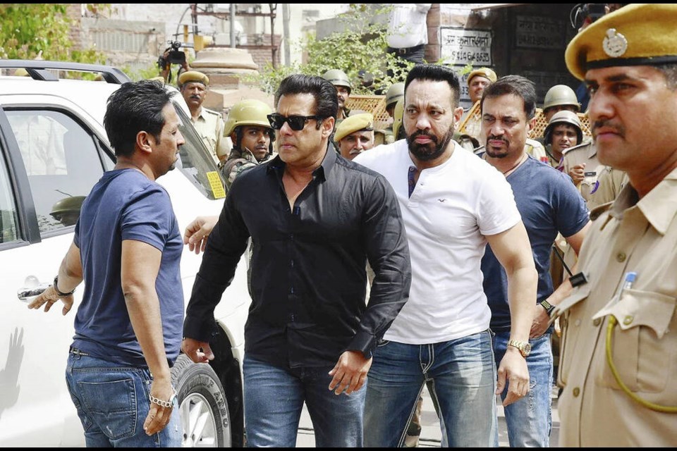 Bollywood star Salman Khan, right, heads to court in Johdpur, in India’s Rajasthan state in 2018, where he was convicted of poaching 
a rare deer. The case is under appeal. SUNIL VERMA, THE ASSOCIATED PRESS 