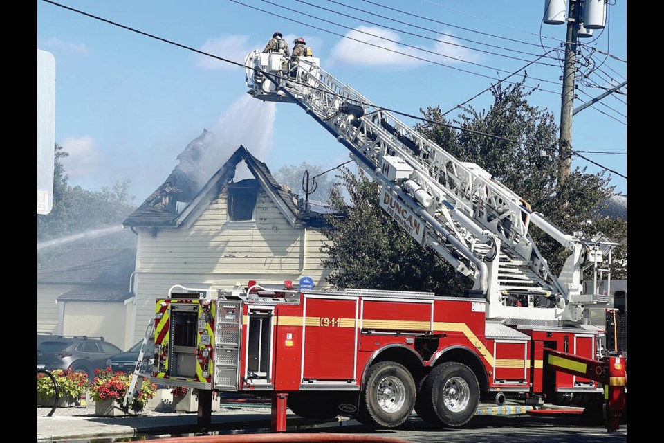 Firefighters extinguish a blaze in the Fabrications clothing store in downtown Duncan on Thursday. The store opened in 1984 and the building it’s in is believed to be more than 100 years old. VIA MICHELLE STAPLES 