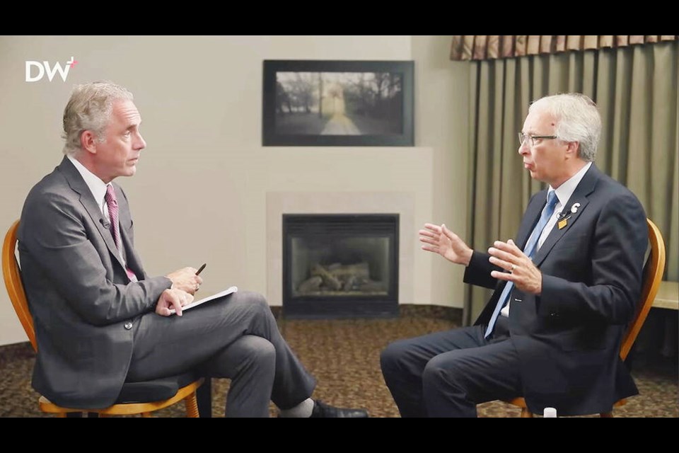 B.C. Conservative Leader John Rustad, right, speaks to Jordan Peterson. VIA YOUTUBE 