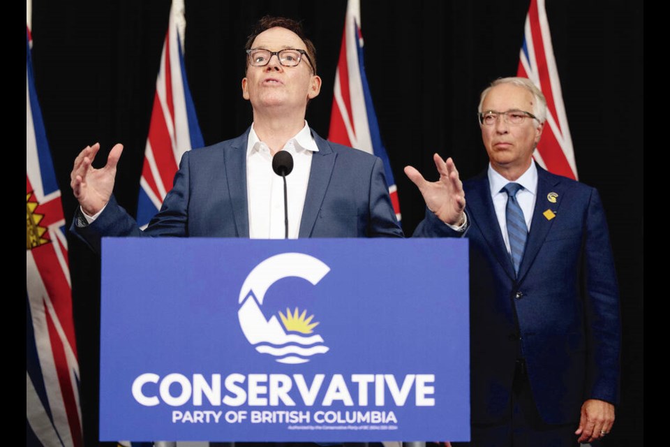 BC United Leader Kevin Falcon appears at a news conference with saʴý Conservative Leader John Rustad to announce BC United is suspending its operations and will not field candidates in the Oct. 19 provincial election, in Vancouver on Wednesday. JASON PAYNE, PNG  