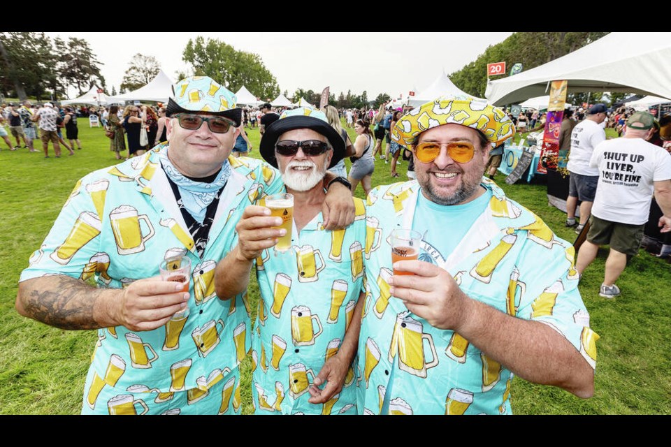 Left to right, Levin Langlands, Randy Swanson and Jon Moser wear matching three-piece beer-mug outfits for the Great Canadian Beer Festival on Saturday. Canada’s longest-running beer festival, which started in 1993, was at a new location this year, in Victoria’s Topaz Park. DARREN STONE, TIMES COLONIST 