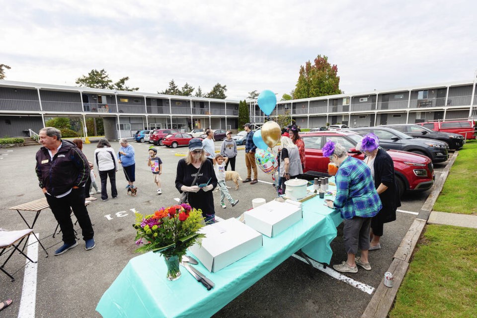 Residents of Christie Apartments in View Royal gather to celebrate Tuesday after the province’s Residential Tenancy Branch dismissed their landlord’s application for a $130-a-month increase in rent. DARREN STONE, TIMES COLONIST  