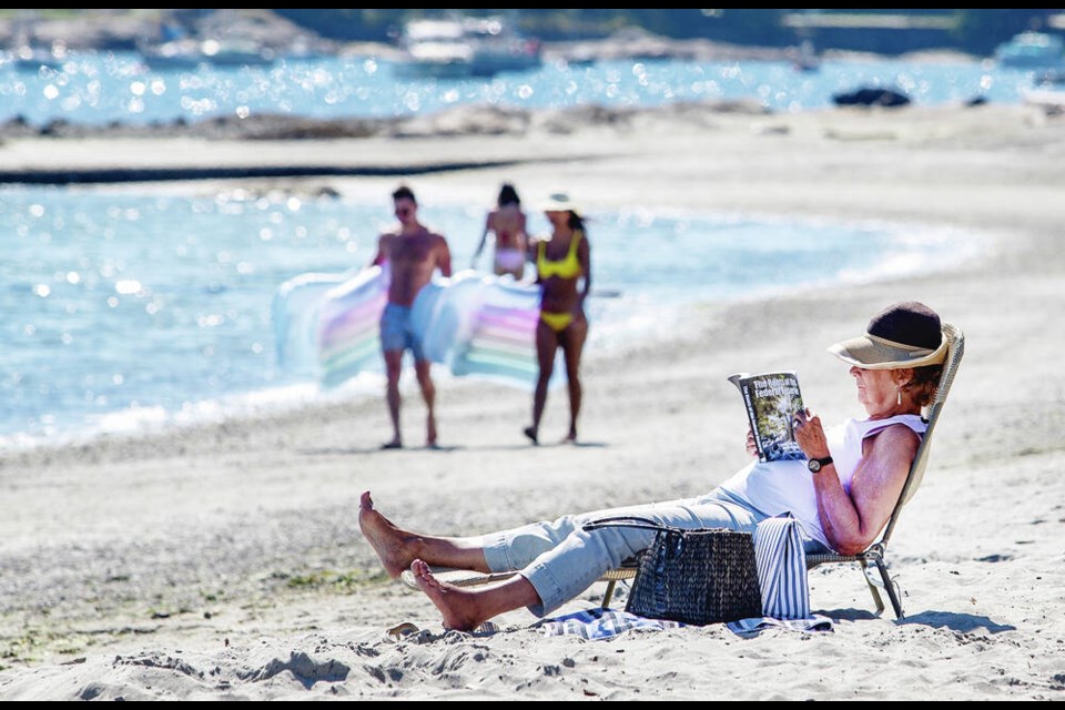 Beachgoers enjoy the sunshine at Willows Beach in Oak Bay on Thursday. DARREN STONE, TIMES COLONIST 