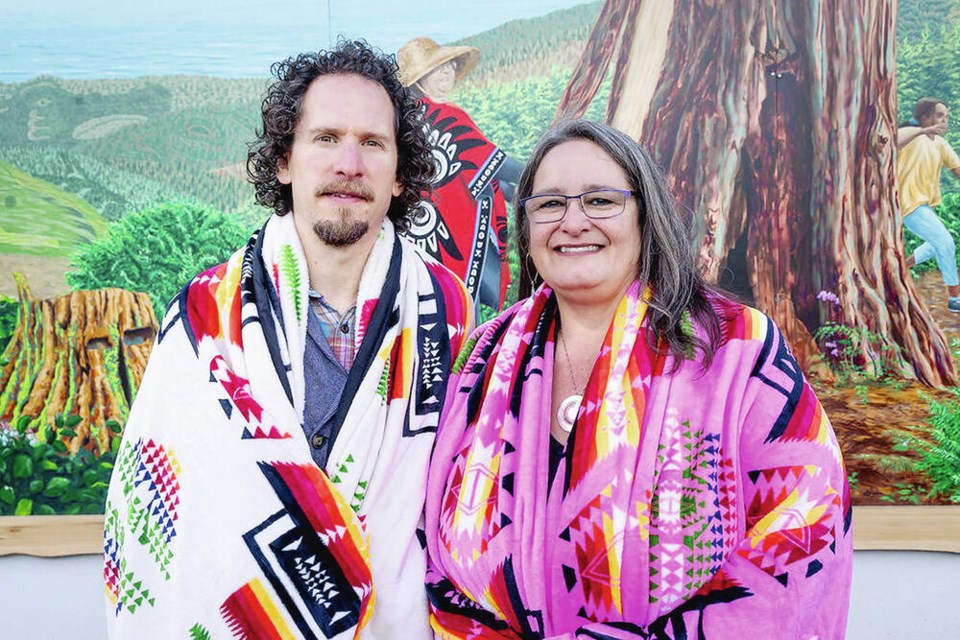 Artists Diego Narvaez and Shelley Davies in front of the mural, created with support from the District of Sooke and Mosaic Forest Management. VIA DISTRICT OF SOOKE 