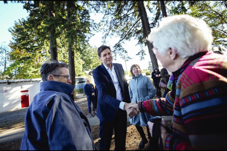 BC NDP Leader David Eby greets supporters during a campaign stop in Nanaimo on Wednesday. Both Eby and BC Conservative Leader John Rustad have promised a new patient tower for the city. THE CANADIAN PRESS/Darryl Dyck 