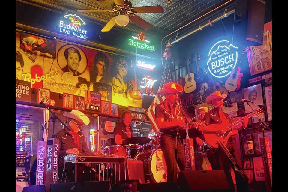 The Cowpokes, a two-step classic country band, play at one of Nashville’s popular honky-tonks Robert’s Western World to a crowd of country enthusiasts. The four-block stretch on Broadway is full of bars that don’t charge a cover for visitors to pop in and enjoy a drink while listening to music. KIM PEMBERTON 