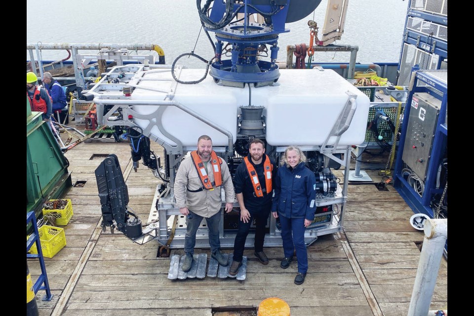 From left, Ryan Anderson, president of Canpac Marine Services, Josh Tetarenko, Canpac’s director of ROV operations, and Meghan Paulson, Ocean Networks Canada executive director of observatory operations, with the new remotely operated vehicle designed to descend to depths of 6,000 metres. TIMES COLONIST 