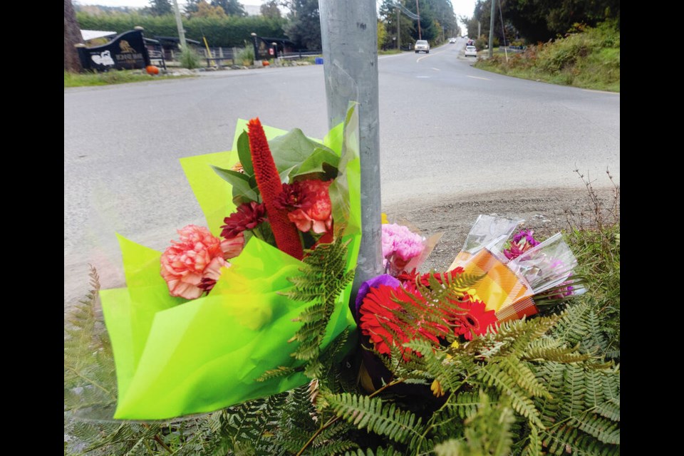 Flowers at the scene of the fatal crash on Tanner Road at Central Saanich Road. DARREN STONE, TIMES COLONIST 