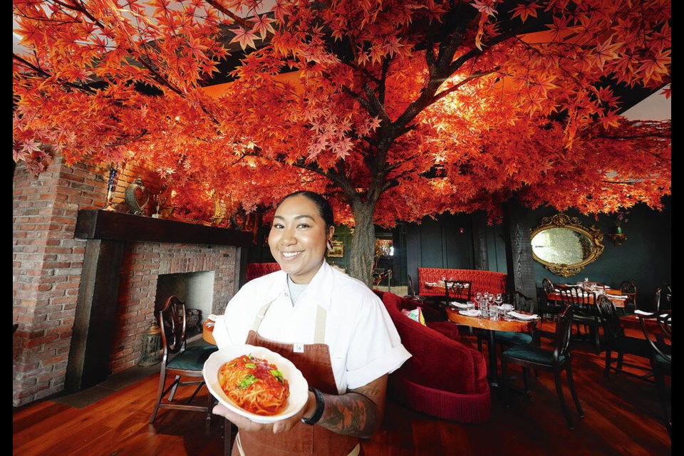 Chef Andrea Alridge shows off a plate of spaghetti pomodoro in the dining room at Rosemead House’s Janevca Kitchen and Lounge in ­Esquimalt. They’ll host their grand opening on Wednesday. ADRIAN LAM, TIMES COLONIST  