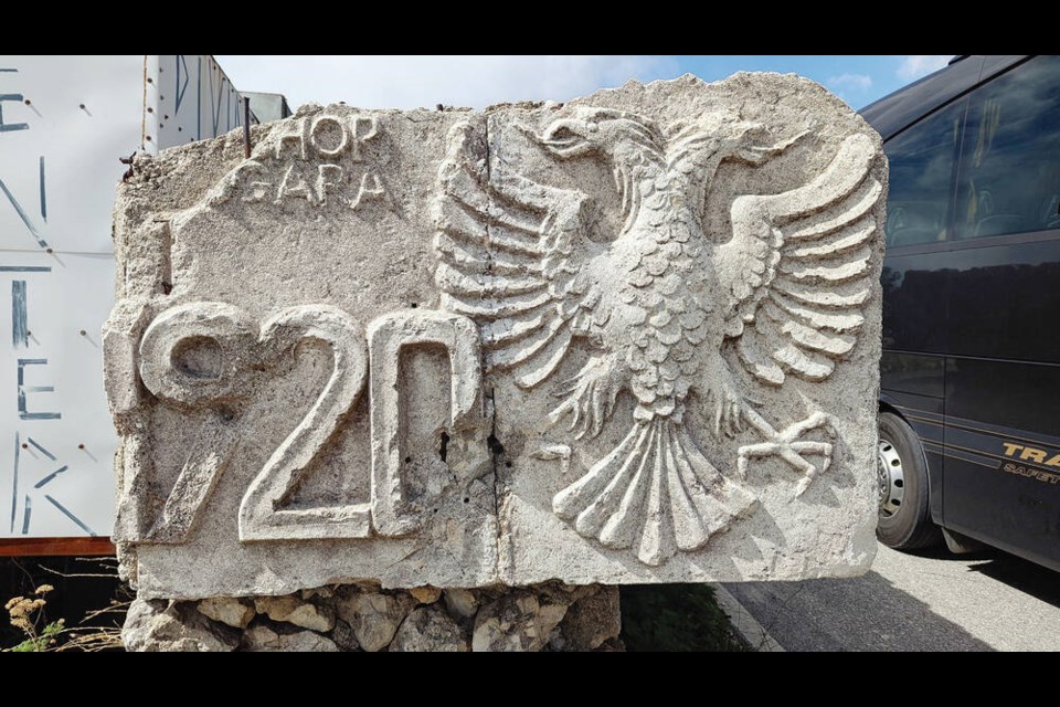 Early Albanian Republic carving from 1920, currently taking up a parking stall at a roadside restaurant. DAVID SOVKA 