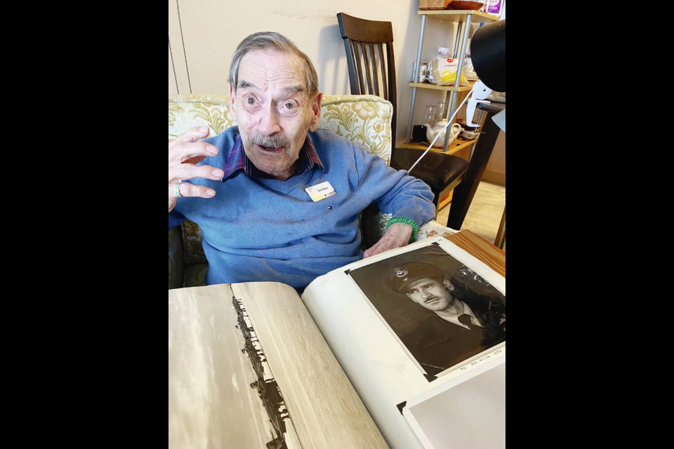 Don Nixon with a portrait of himself in the 1950s when he was training fighter pilots in jets. Nixon flew 35 missions over ­Holland, France and Germany during the war, but was never wounded in action. “I guess I was just lucky,” he says.  “I don’t know how I did it.”  TIMES COLONIST 