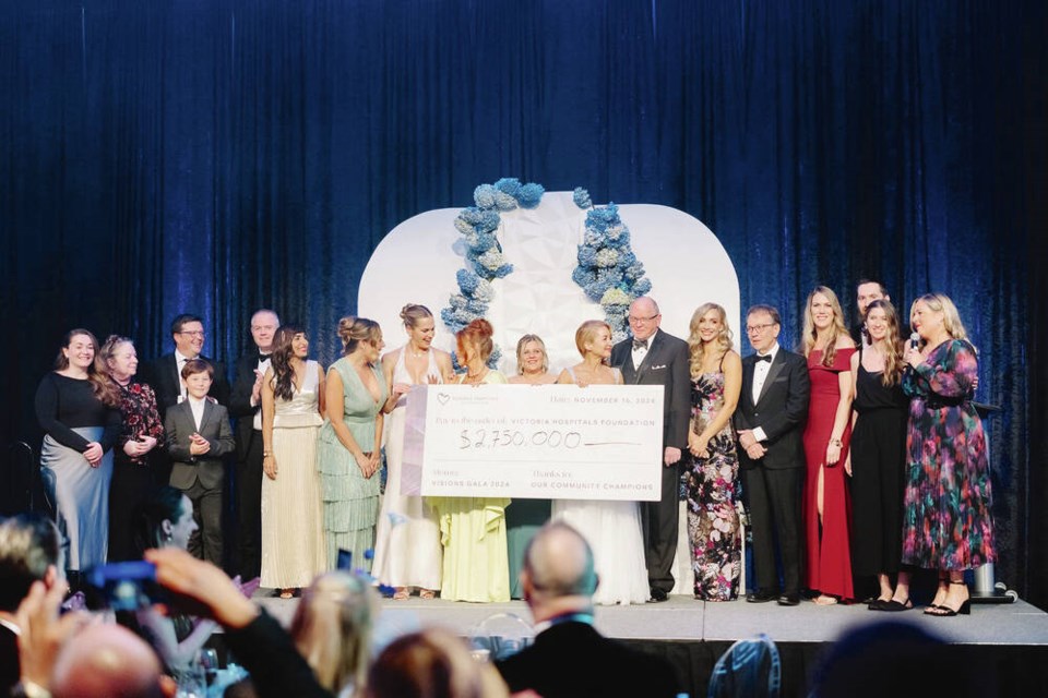 Members of the campaign steering committee and others take the stage with a giant cheque for $2.75 million at the 32nd annual Visions gala, hosted by the Victoria Hospitals Foundation. VIA VICTORIA HOSPITALS FOUNDATION 