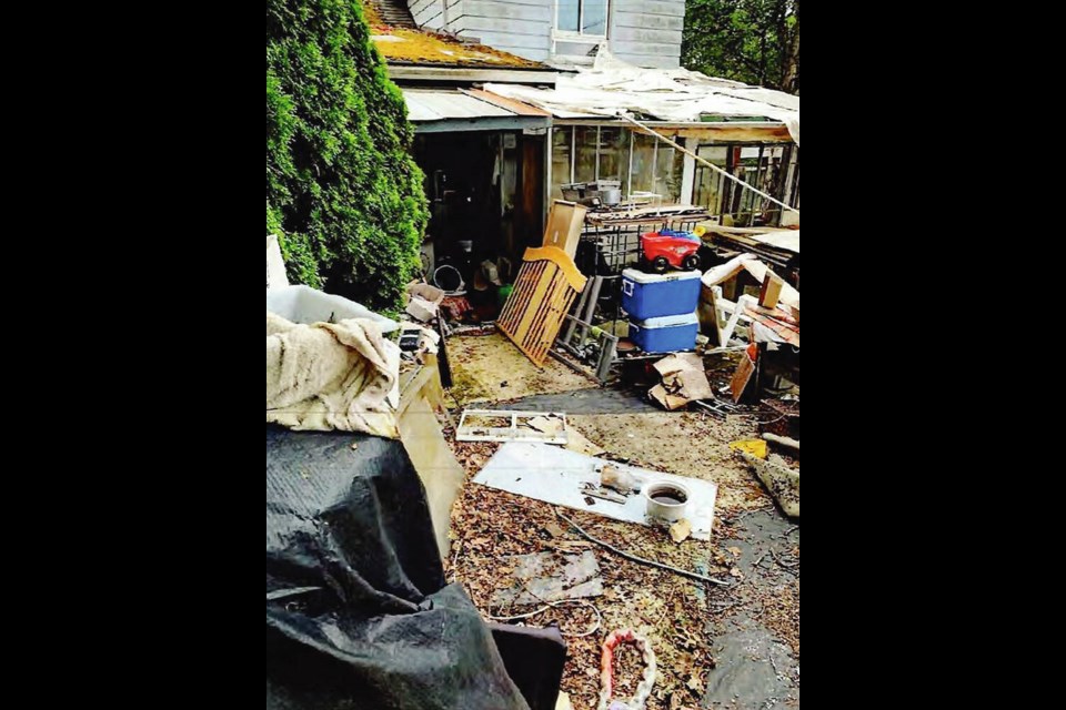 A Burnside Road West property during an inspection by Saanich staff. VIA DISTRICT OF SAANICH 