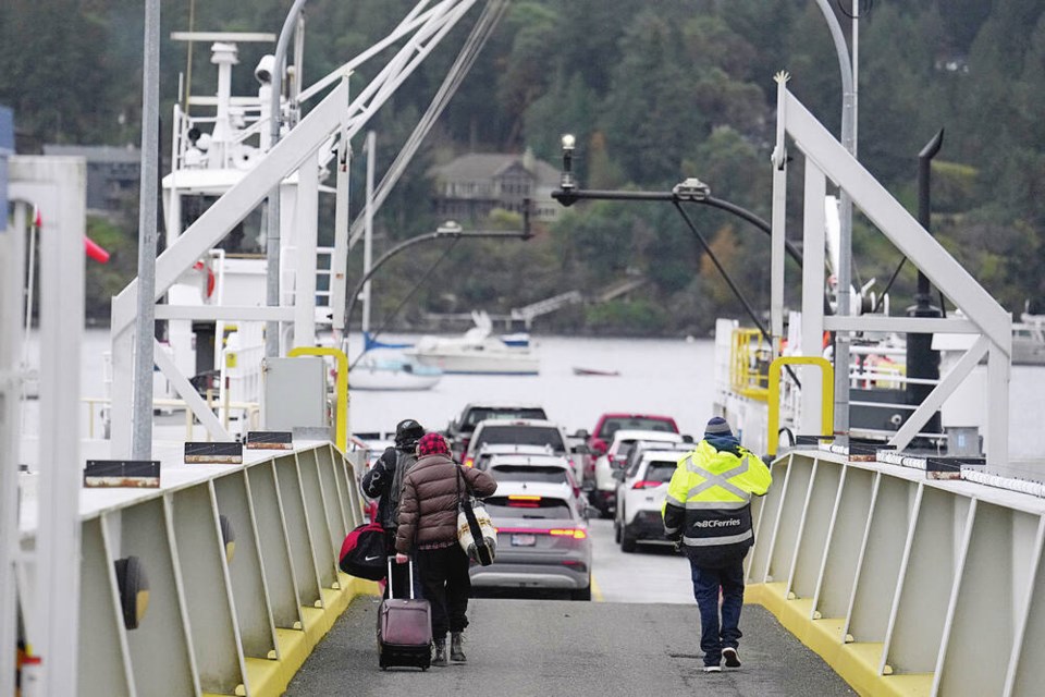 Foot passengers and vehicles board the MV Klitsa at Brentwood Bay for the trip to Mill Bay in late October. The viability and value of the route have been challenged repeatedly over the years, prompted by concerns over low passenger numbers and the expense of infrastructure  despite its role as a relief valve when the Malahat is blocked by a crash, washout or other problem.	ADRIAN LAM, TIMES COLONIST 