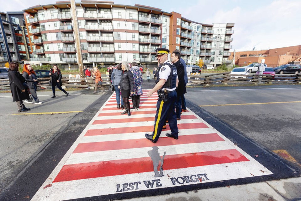 West Shore RCMP Supt. Todd Preston was among those checking out a new crosswalk next to the Branch 91 Legion on Station Avenue in Langford. DARREN STONE, TIMES COLONIST 