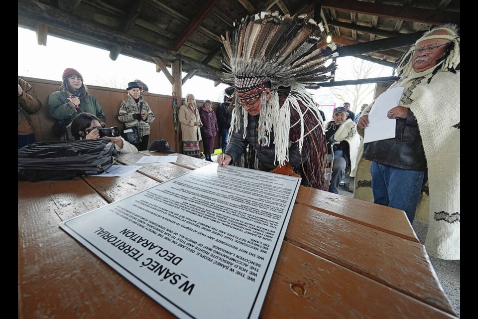 Tsartlip Nation Hereditary Chief Paul Sam Sr. (Telaxten) signs the declaration calling for a halt to the commercial herring season, set to open Nov. 24. ADRIAN LAM, TIMES COLONIST  