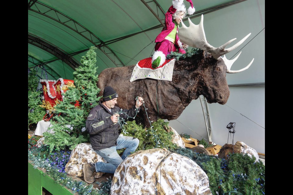 Rob Galey works on the Galey Farms float for Saturday night’s 42nd Peninsula Co-op Santa Claus Parade, which starts 
at 5:30 p.m. at Government and Belleville streets. Story and parade route map, A5 DARREN STONE, TIMES COLONIST 