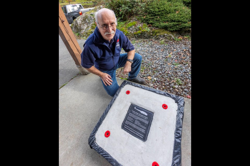 Jacques Marc, explorations director for the Underwater Archaeological Society of B.C., with a plaque that will be placed next to a Second World War-era plane wreck in Saanich Inlet. DARREN STONE, TIMES COLONIST 