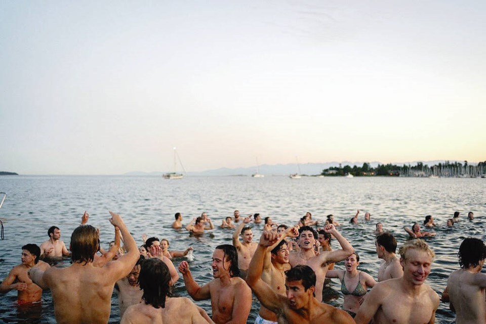 Cold-water swimmers take the plunge at Cadboro Bay in April 2024 during a UVic Polar Dippers student club event. COURTESY PIERRE MCGEOUGH 