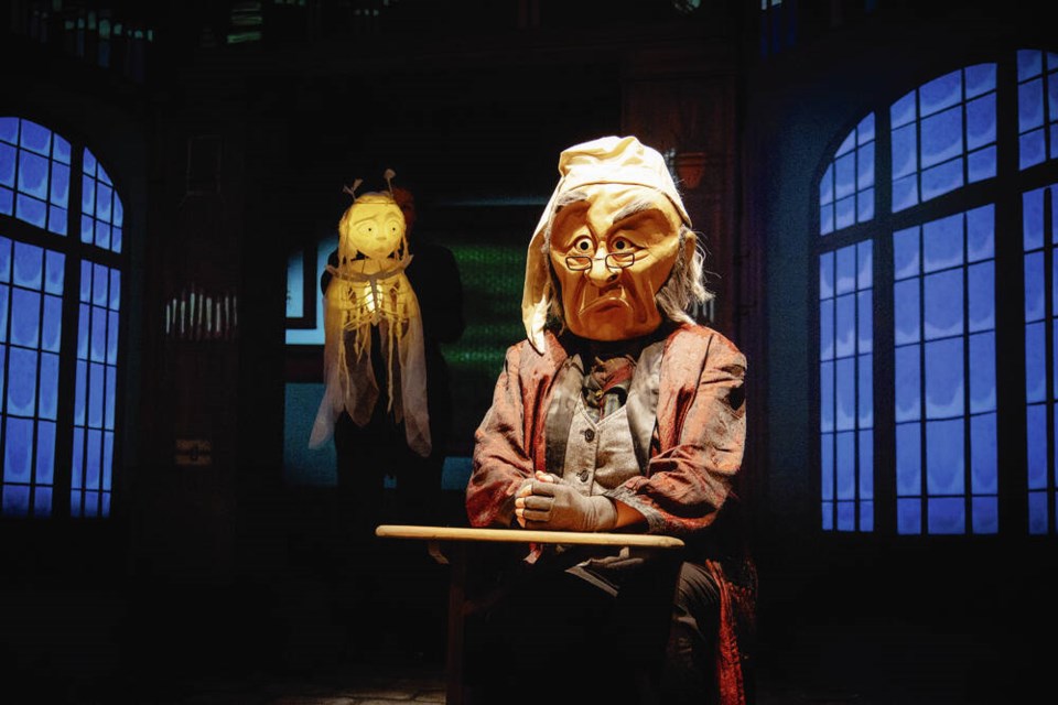 Sarah Robertson as The Ghost of Christmas Past (puppeteer) and Kate Braidwood as Scrooge in a scene from A Wonderheads Christmas Carol, running Dec. 18-21 at the McPherson Playhouse in Victoria. PETER POKORNY 