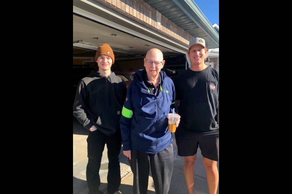 Charges have been laid in the death of 80-year-old Pat Hare, pictured with his grandsons Ethan Hare, left, and Ryan Hare, was struck and killed near Qualicum Beach in March after he stopped to help a woman who had hit a power pole. VIA FAMILY 